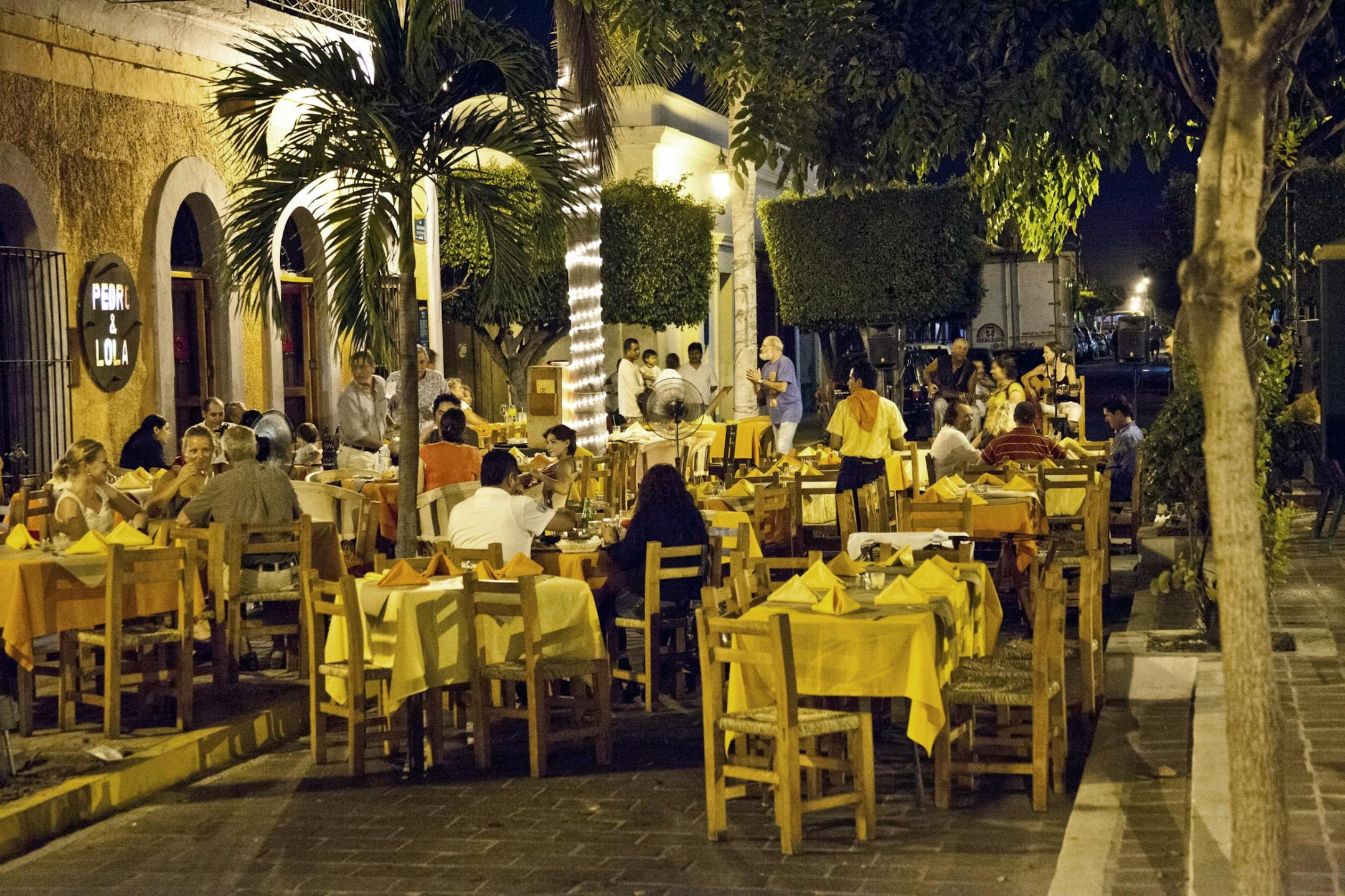 A starry night and palm trees brings romance to La Bohemia Café and Bar, on the Plaza Machado, Mazatlan, Mexico.