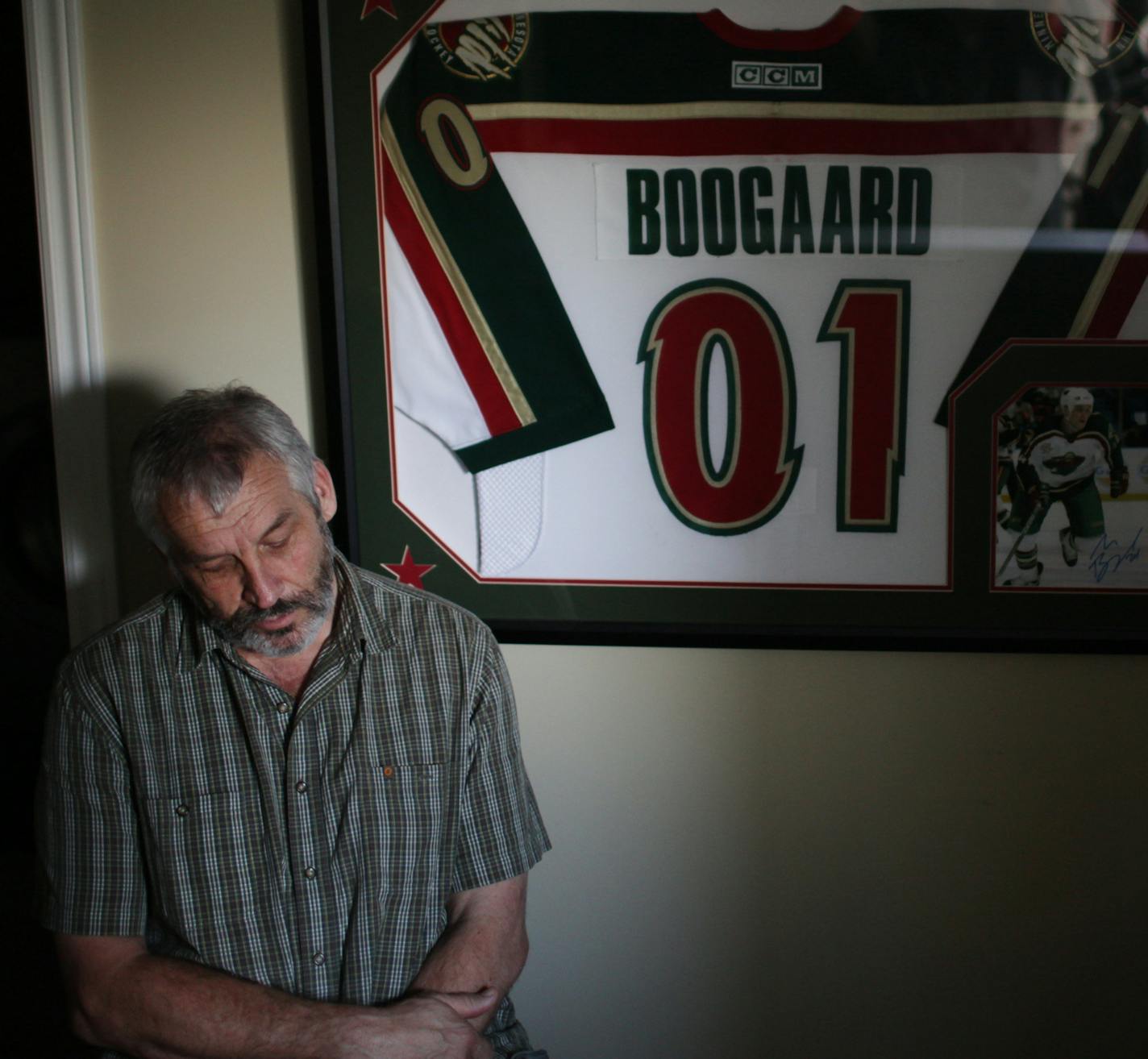 Len Boogaard, who encouraged his son Derek Boogaard's hockey career, next to Derek's jersey, in Ottawa, Ontario, Canada, Aug. 30, 2011. While Derek, who died from an accidental overdose in May, was unable to reach the NHL on his hockey merits alone, he was able to use his boxing skills to become the NHL's most fearsome fighter, the Boogeyman. (Marcus Yam/The New York Times) ORG XMIT: XNYT38