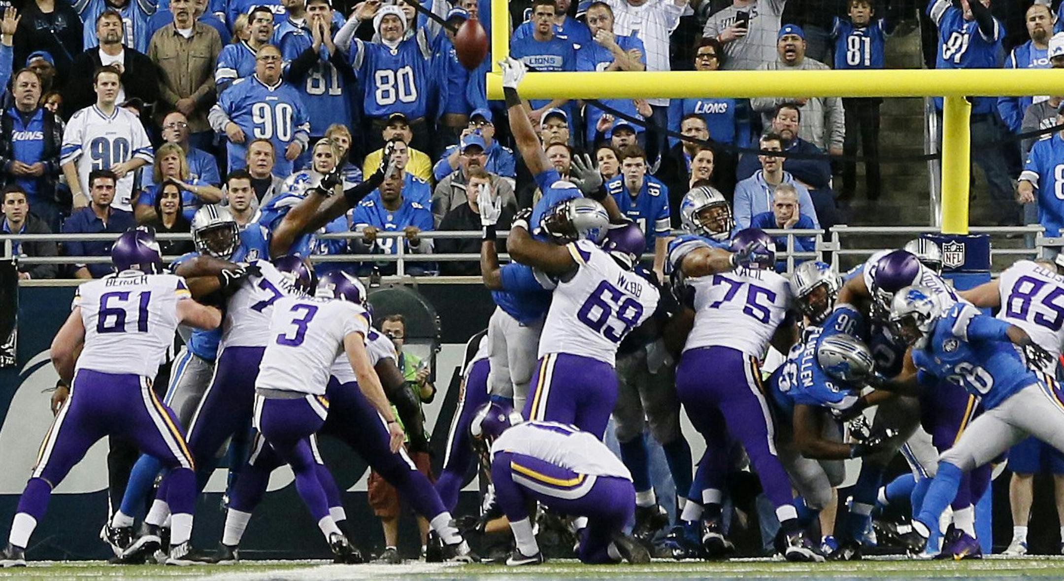 The kick by Minnesota Vikings kicker Blair Walsh (3) is deflected during the second half of an NFL football game against the Detroit Lions at Ford Field in Detroit, Sunday, Dec. 14, 2014. (AP Photo/Rick Osentoski) ORG XMIT: MIN2014121419492745