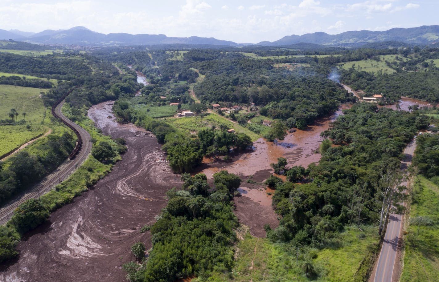 An aerial view shows flooding triggered by a dam collapse near Brumadinho, Brazil, Friday, Jan. 25, 2019. Brazilian mining company Vale SA said it didn&#x2019;t yet have information on deaths or injuries at the dam but said that tailings have reached the community of Vila Ferteco. (Bruno Correia/Nitro via AP)