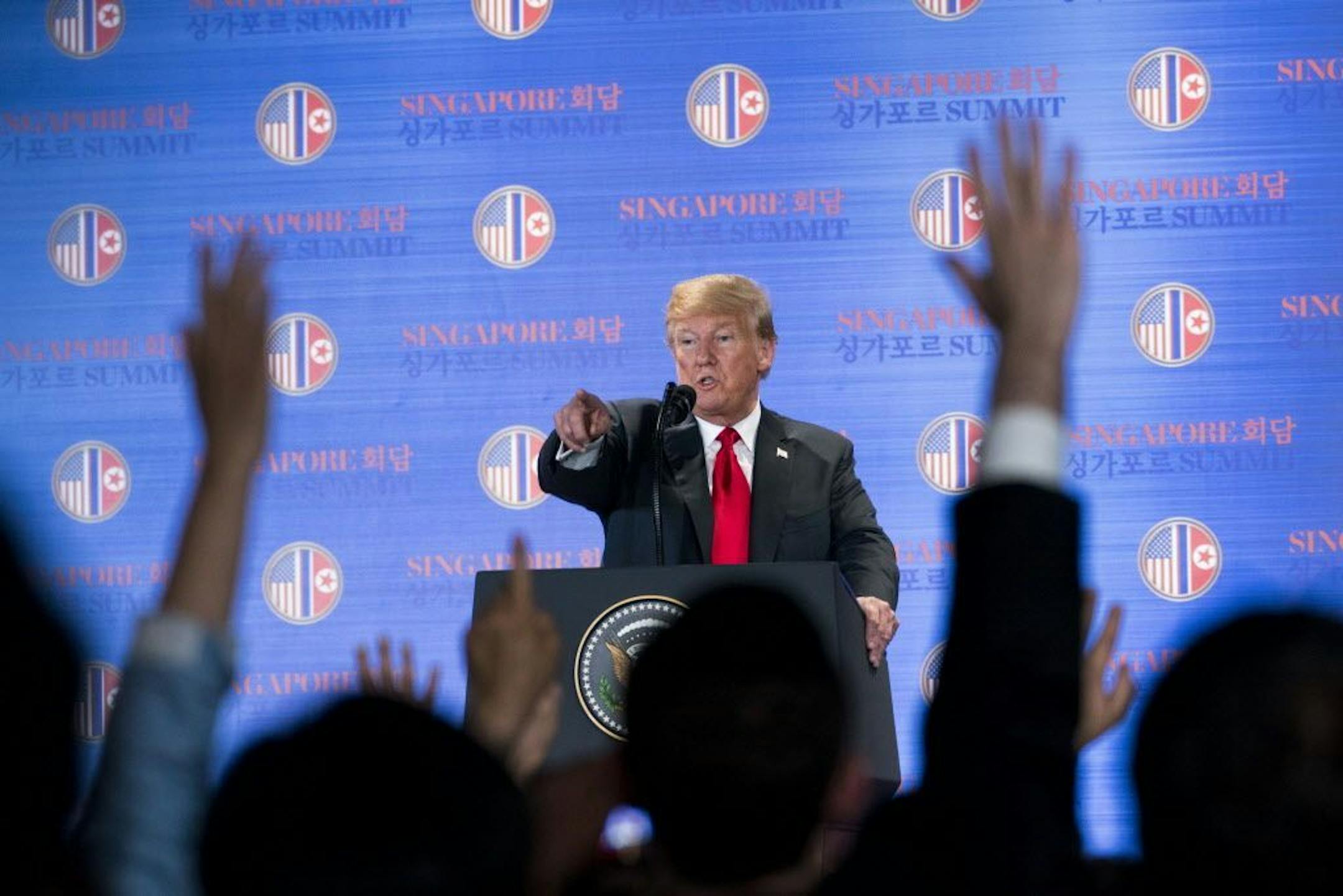 President Donald Trump fields questions from reporters at a news conference after meeting with Kim Jong Un of North Korea, on Sentosa Island in Singapore, June 12, 2018.
