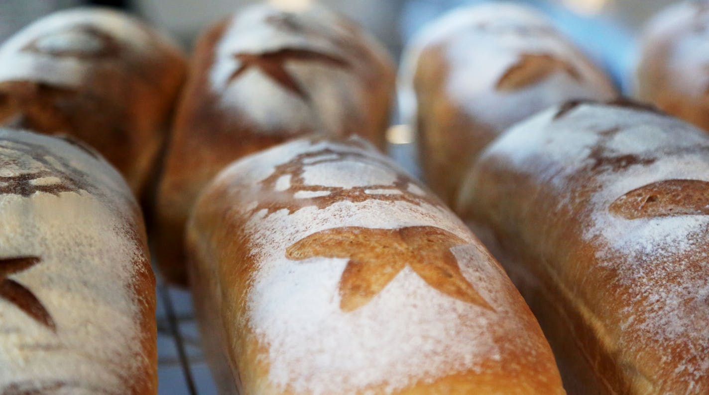 Fresh loaves of Fwuffy bread sit on a rack at Brake Bread, an artisanal bakery that got it's start delivering bread to the area by bicycle and is now located on W. 7th near downtown and seen Thursday, Sept. 1, 2016, in St. Paul, MN.](DAVID JOLES/STARTRIBUNE)djoles@startribune Brake Bread, a new W. Seventh Street bakery, has humble beginnings: from a basket rigged to a bicycle. That's not where they baked their naturally leavened, artisan bread. But it's how they delivered it and built a business