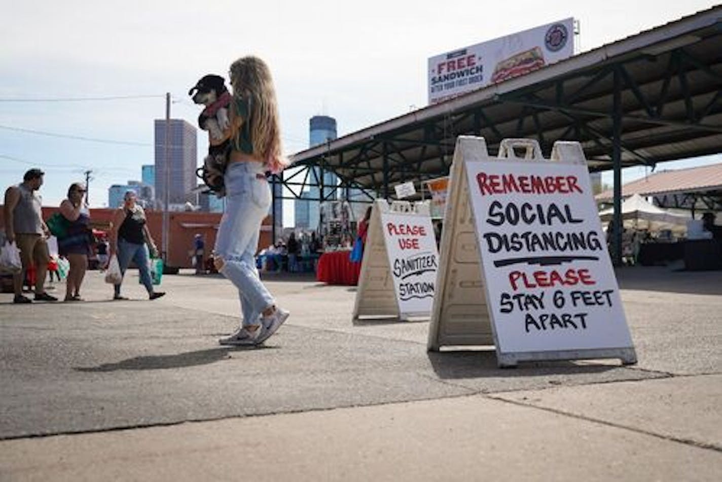 Signs of the times at the Minneapolis Farmers Market, which will be open daily through October.