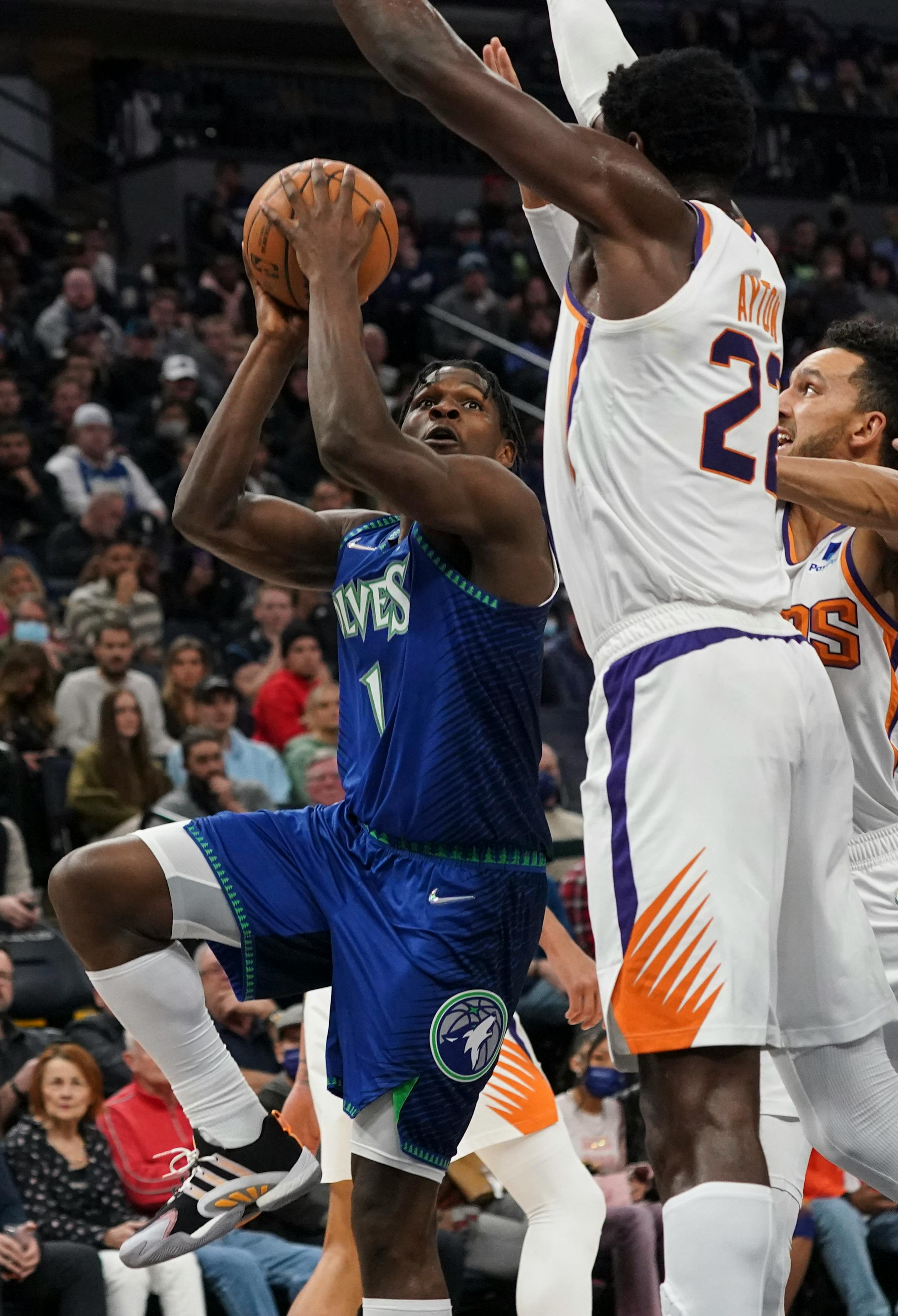 Minnesota Timberwolves forward Anthony Edwards (1) winds up for a shot in the fourth quarter.