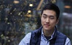 Harvard University graduate Jin K. Park, who holds a degree in molecular and cellular biology, listens during an interview in Cambridge, Mass., Thursd