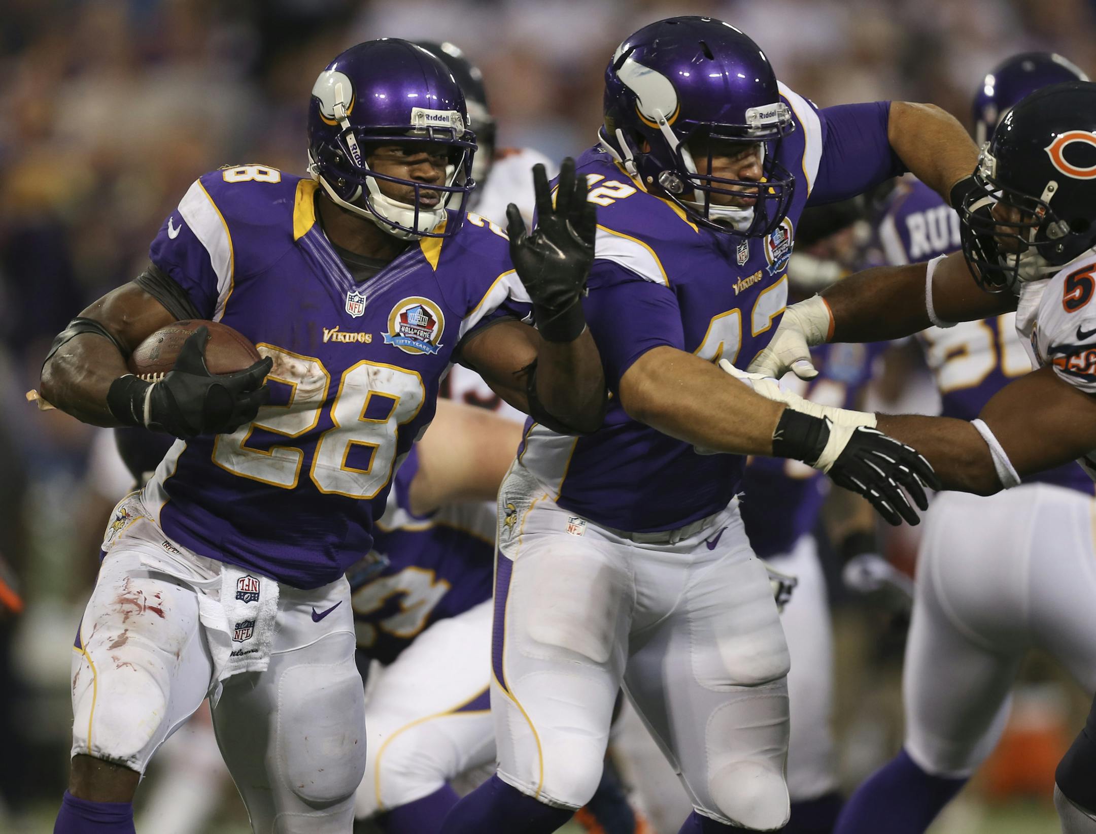 The Minnesota Vikings beat NFC rivals the Chicago Bears 21-14 in an NFL football game Sunday afternoon, December 9, 2012 at Mall of America Field in Minneapolis, Minn. Adrian Peterson followed the block of teammate Jerome Felton while gaining five yards around the right end in the fourth quarter. ] JEFF WHEELER &#x201a;&#xc4;&#xa2; jeff.wheeler@startribune.com ORG XMIT: MIN1212091624520761