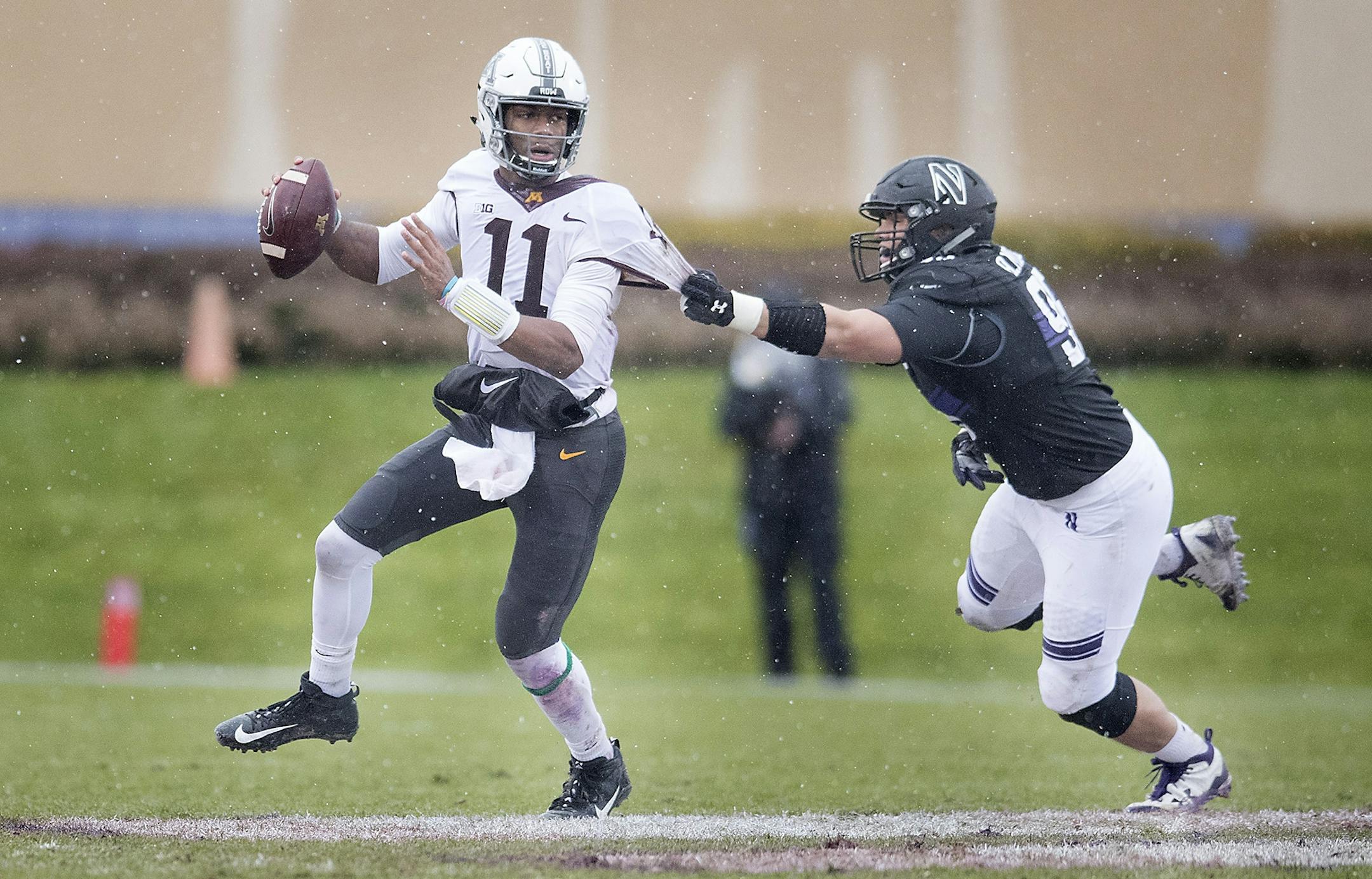 Minnesota quarterback Demry Croft was sacked by Northwestern defensive lineman Alex Miller during the third quarter.