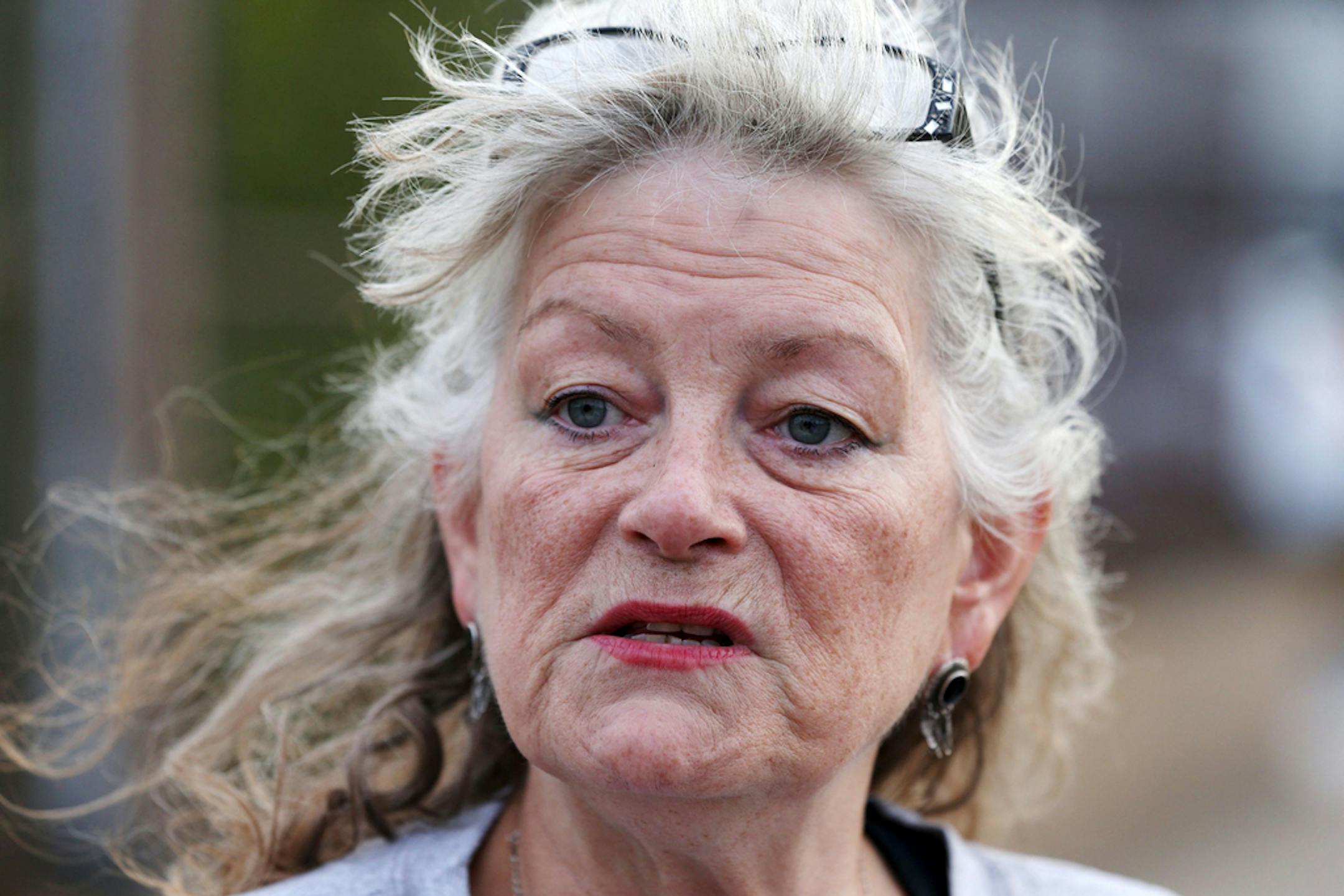 Veronica Wolski, a supporter of Sen. Bernie Sanders' campaign for president, stands on a pedestrian bridge on Chicago's Northwest side while getting her political message out to drivers below on the Kennedy Expressway on Oct. 7, 2016. Wolski, the QAnon adherent whose recent hospitalization made her a cause for the controversial medication ivermectin, died in the intensive care unit of AMITA Health Resurrection Medical Center early Monday. (Chris Sweda/Chicago Tribune/TNS) ORG XMIT: 26862987W