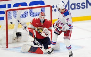 New York Rangers center Alex Wennberg (91) deflects the puck into the net against Florida Panthers goaltender Sergei Bobrovsky (72) in an overtime per