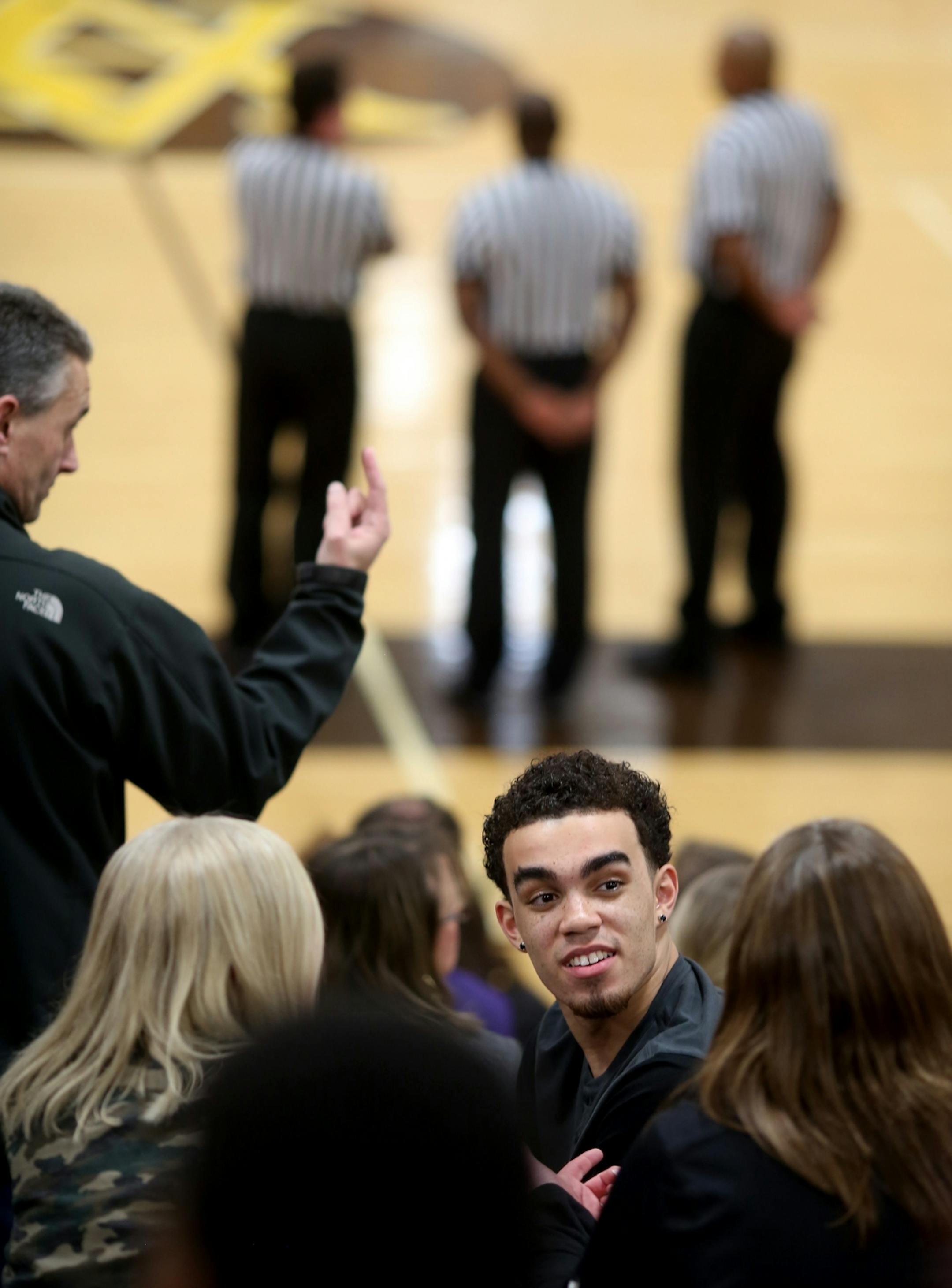 Duke freshman Tyus Jones, talked with members of the crowd before his brother's game.