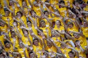 New University students cheered before the Convocation, the official welcome ceremony for incoming freshmen, at Mariucci Arena, Thursday, August 29, 2
