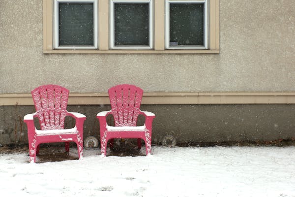 Lawn furniture is prematurely set outside on Sunday, April 8, 2018 in Minneapolis, Minn. The weather produced a late snow storm for the second Sunday 