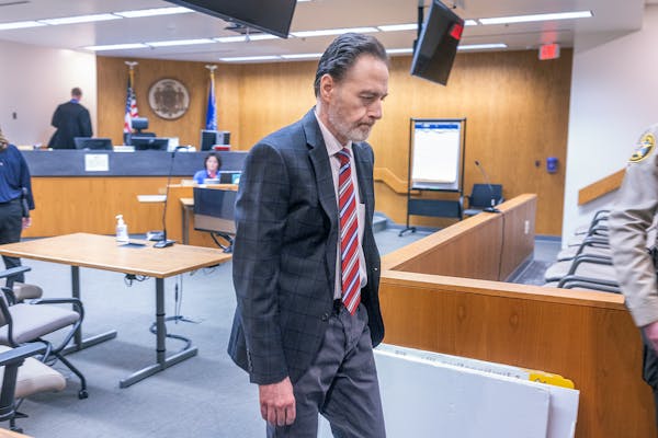 Nicolae Miu makes his way out of the courtroom after the verdicts at the St. Croix County District Court in Hudson, Wis., on Thursday.
