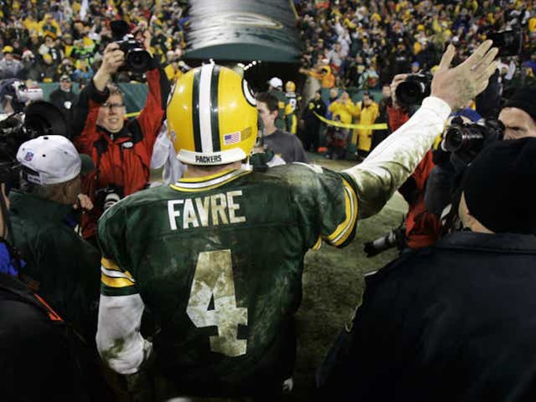 Brett Favre walks off the field after rallying the Packers past the Bengals.