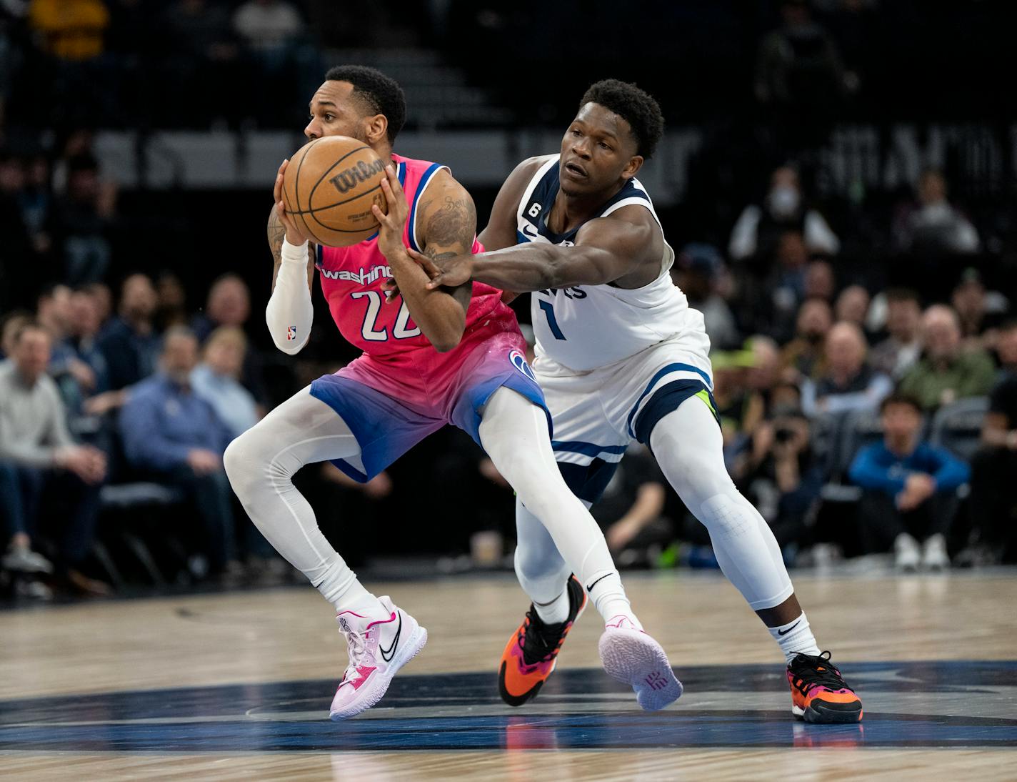 Minnesota Timberwolves guard Anthony Edwards (1) tried to knock the ball from Washington Wizards guard Monte Morris (22) in the first half. The Minnesota Timberwolves hosted the Washington Wizards at Target Center in Minneapolis, Minn., on Thursday, Feb. 16, 2023.