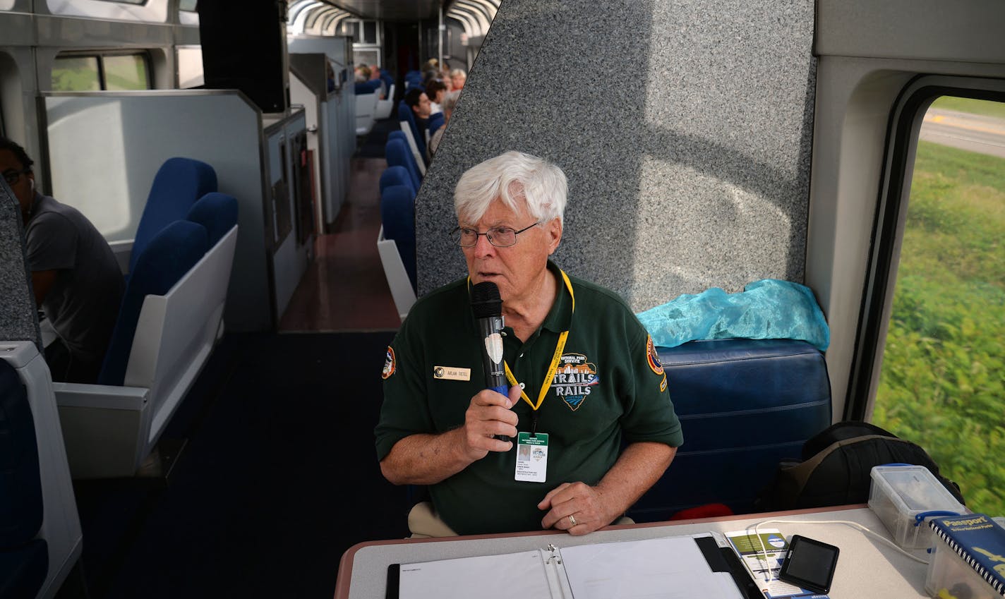 Volunteer Master Ranger Corps Arlan Tietel, of Woodbury, announced to the train car what was outside their windows as part of the Trails and Rails program on the Amtrak Train that departed from Union Depot in St. Paul, Minn. and went to Chicago, Illinois, on Monday July 27, 2015. ] RACHEL WOOLF &#xb7; rachel.woolf@startribune.com