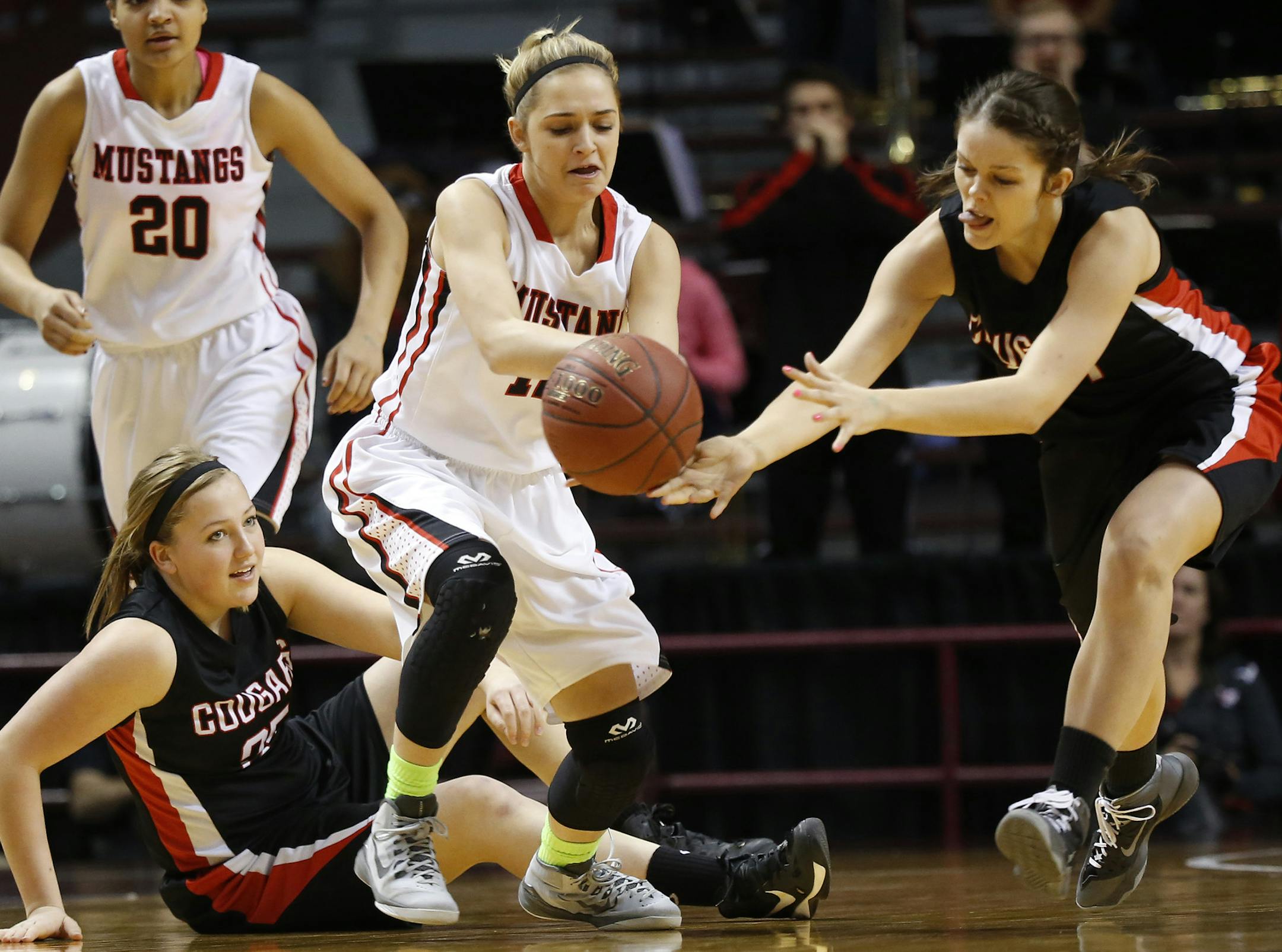 Ada-Borup's Miki Lee and Maranatha Christian Acadmey's Alaina Jarnot went after a loose ball during the first half. ] (KYNDELL HARKNESS/STAR TRIBUNE) kyndell.harkness@startribune.com Class1A girls' basketball finals Ada-Borup vs Maranatha Christian Academy at Williams Arena in Minneapolis Min., Saturday, March 21, 2015.