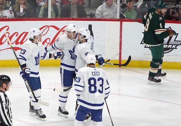 The Maple Leafs celebrated the first goal of the game.