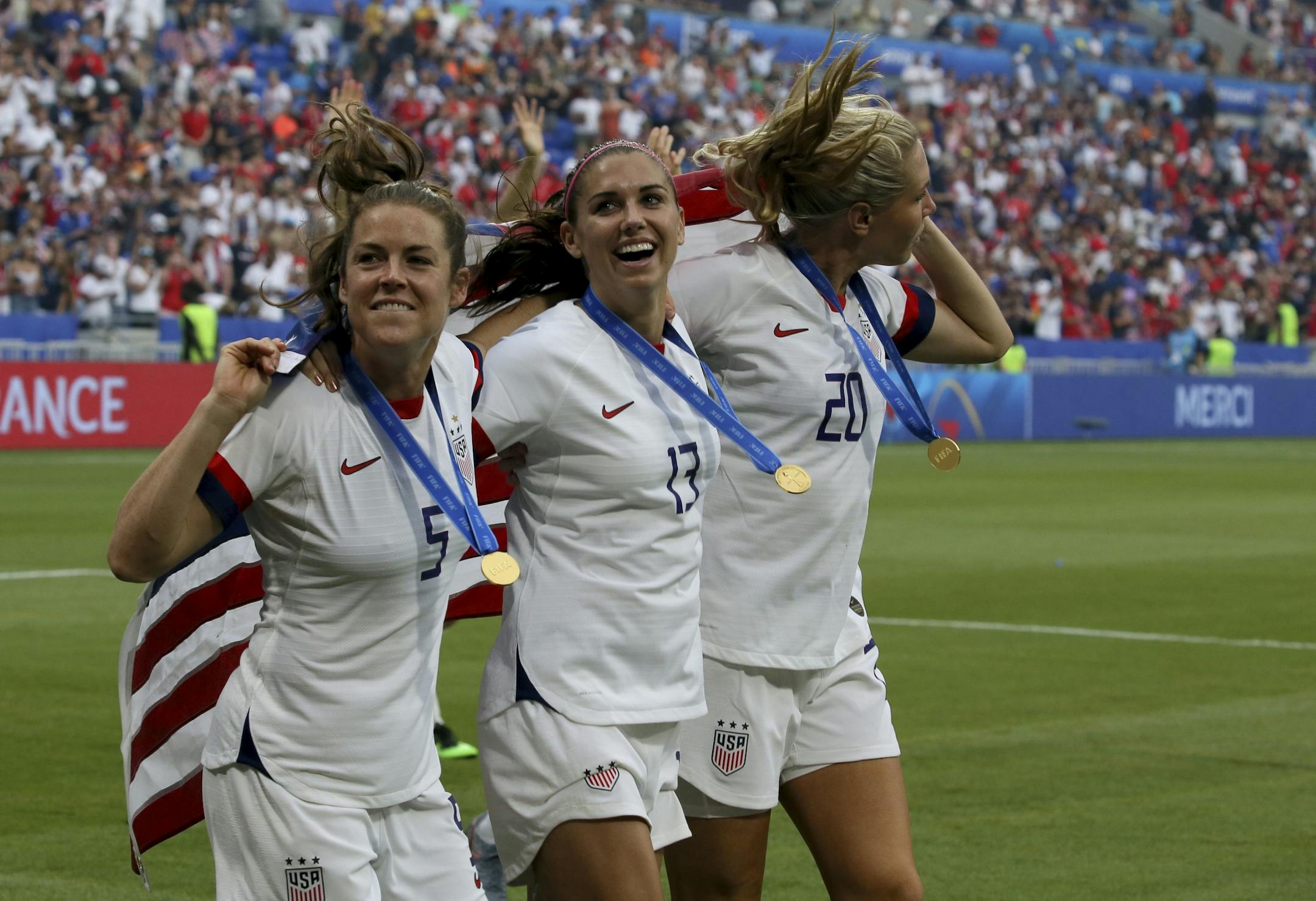 From left: United States' Kelley O Hara, United States' Alex Morgan and United States' Allie Long celebrate their victory in the Women's World Cup final soccer match between US and The Netherlands at the Stade de Lyon in Decines, outside Lyon, France, Sunday, July 7, 2019. US won 2:0.