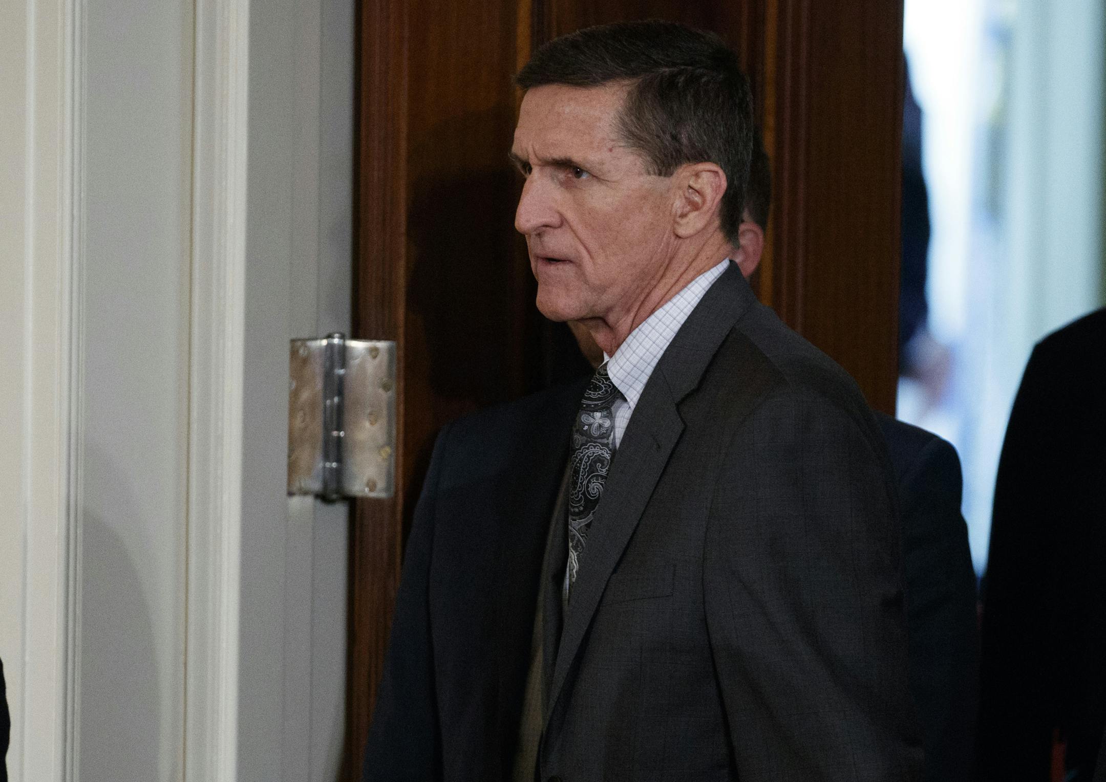 FILE - In this Feb. 13, 2017 file photo, Mike Flynn arrives for a news conference in the East Room of the White House in Washington. The former national security adviser will invoke his Fifth Amendment protection against self-incrimination on Monday, May 22, 2017, as he notifies the Senate Intelligence committee that he will not comply with a subpoena seeking documents. (AP Photo/Evan Vucci, File)