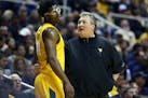 West Virginia head coach Bob Huggins talks to forward Devin Williams (41) during the first half of an NCAA college basketball game against Baylor, Sat