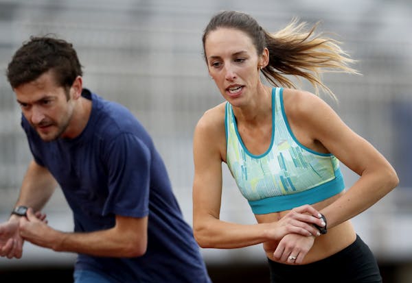 Former Gopher Gabriele Grunewald (with her husband, Justin) continues to run despite recurring bouts of cancer.