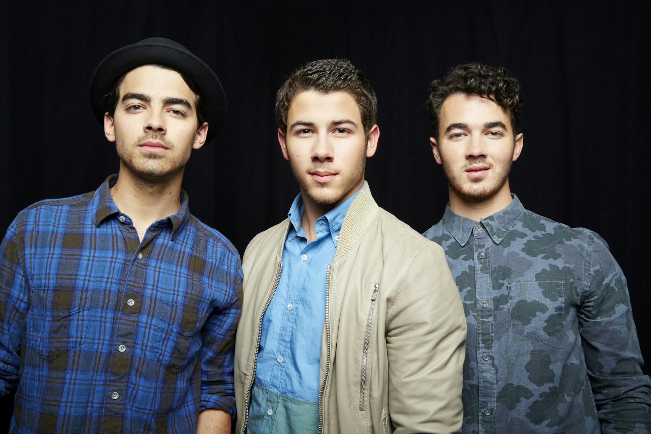 FILE - This April 9, 2013 file photo shows, from left, Joe Jonas, Nick Jonas and Kevin Jonas, of American pop rock band The Jonas Brothers in New York. The band announced Tuesday, Oct. 19, 2013, they're ending their highly successful run. The news comes after the brothers abruptly canceled their tour over creative differences earlier this month. (Photo by Dan Hallman/Invision/AP, File)
