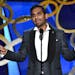 Aziz Ansari presents the award for outstanding writing for a variety series at the 68th Primetime Emmy Awards on Sunday, Sept. 18, 2016, at the Micros