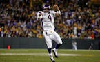 Minnesota Vikings quarterback Brett Favre reacts after throwing for the Vikings’ final touchdown in a 38-26 win over the Green Bay Packers in 2009.