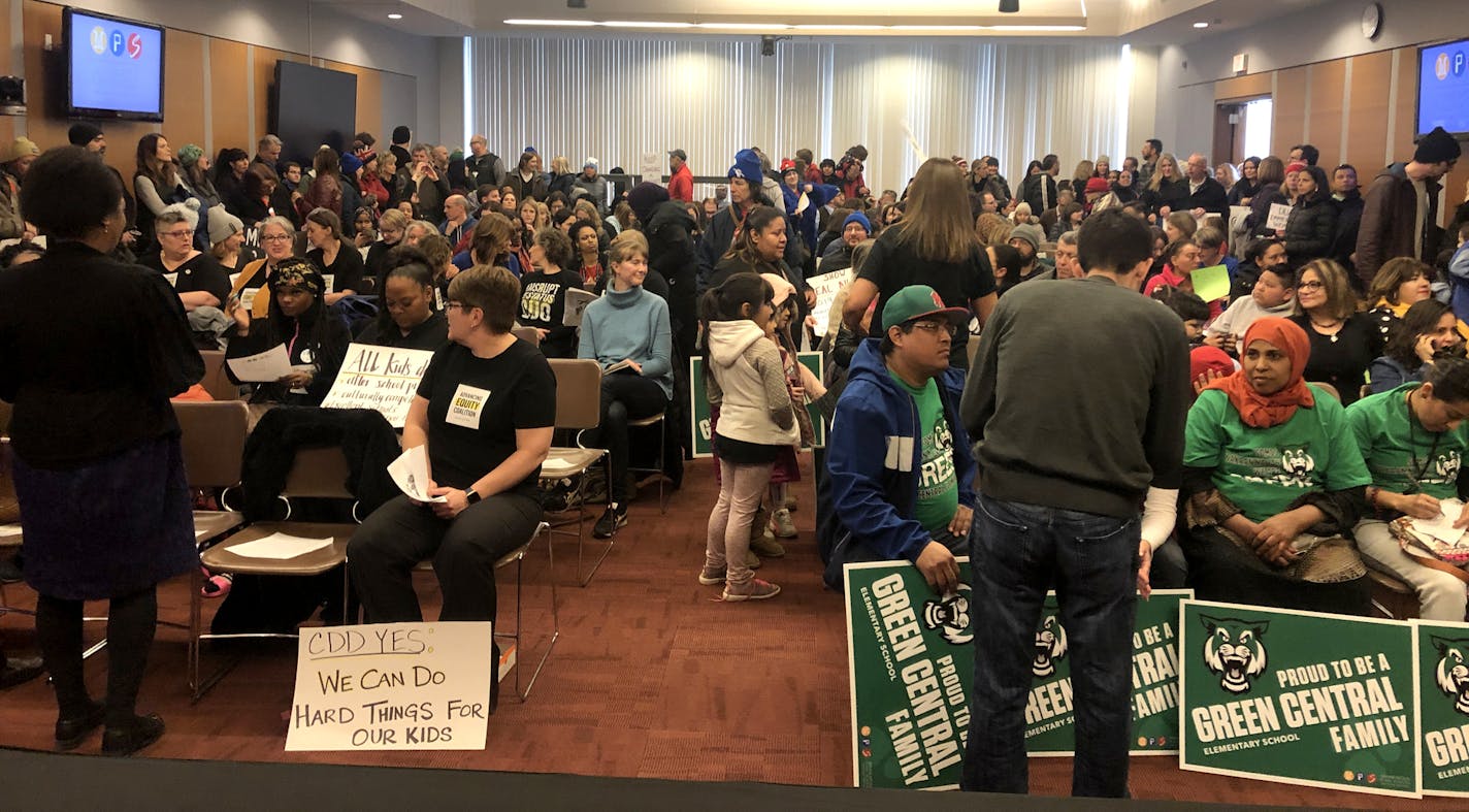 People for and opposed to the Minneapolis school district's restructuring plan (CDD) gathered at the school board meeting . The vote is scheduled for April. Photo by Ryan Faircloth