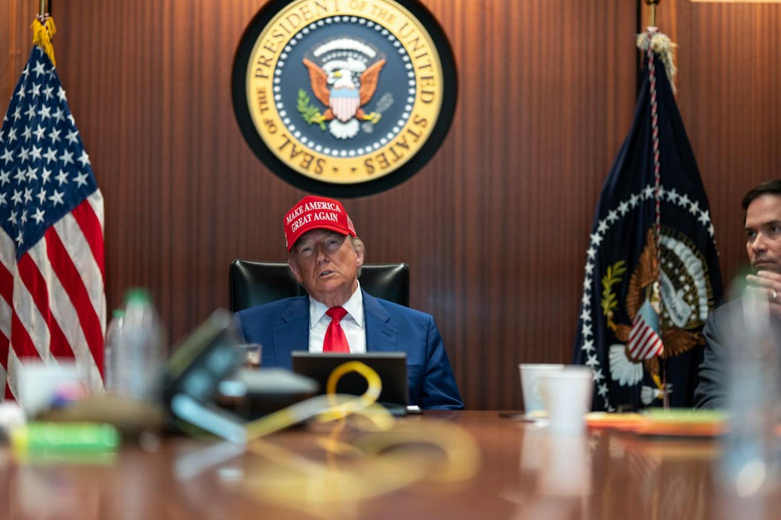 President Donald Trump and Secretary of State Marco Rubio, right, sit in the Situation Room, Saturday, June 21, 2025, at the White House in Washington