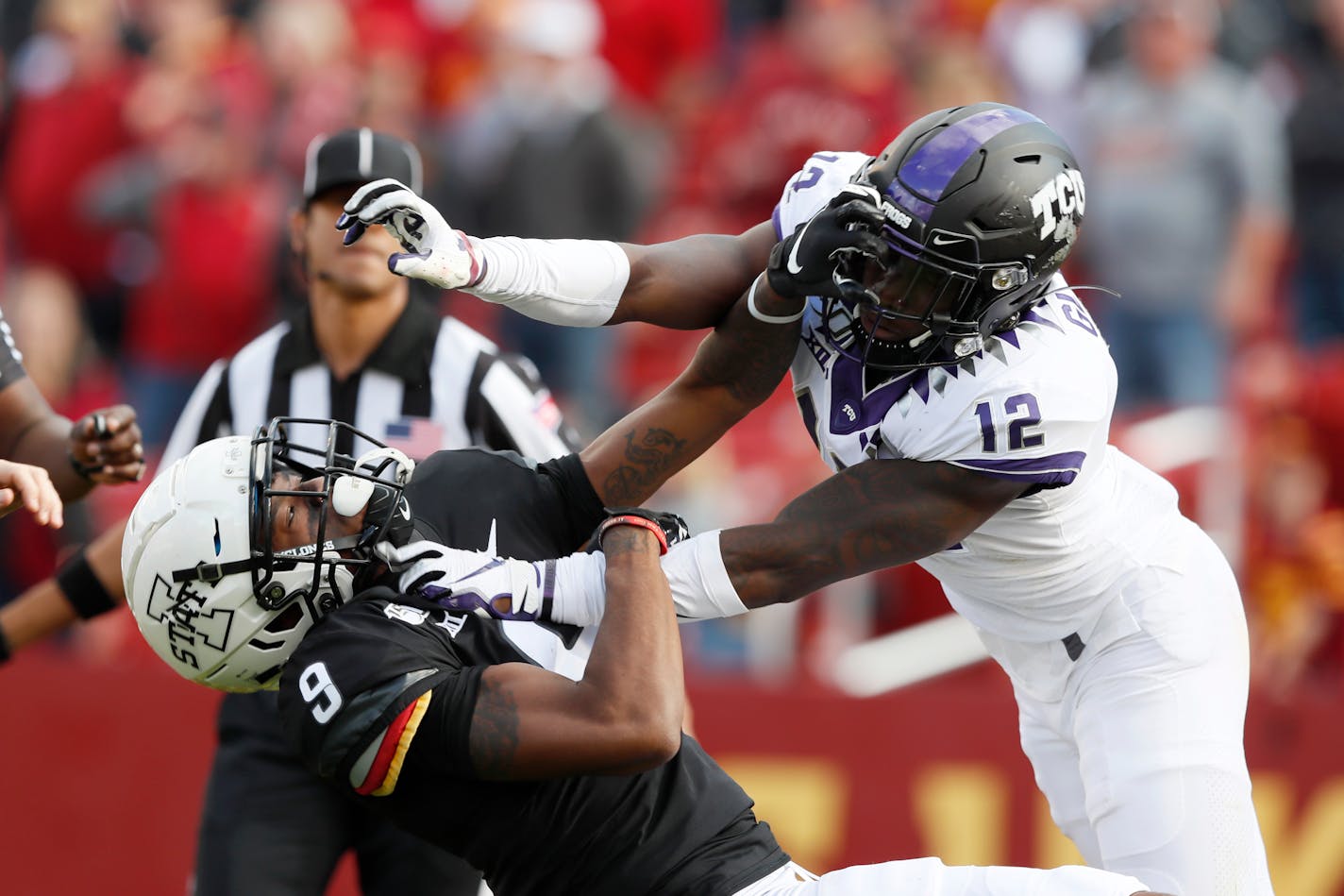 Iowa State wide receiver Joseph Scates, left, fights with TCU cornerback Jeff Gladney (12) during the second half of an NCAA college football game, Saturday, Oct. 5, 2019, in Ames, Iowa. Both players were called for unsportsmanlike conduct on the play. Iowa State won 49-24. (AP Photo/Charlie Neibergall)