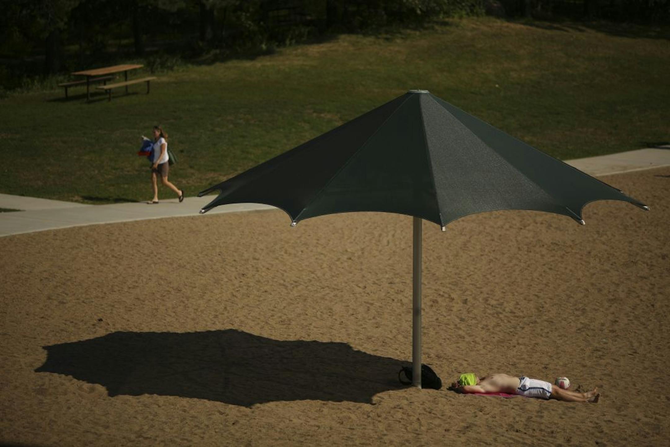 Curtis DeGidio of South St. Paul waited for friends at Schulze Lake in Eagan Thursday. "I remember it being more crowded when I came here as a kid," he said.