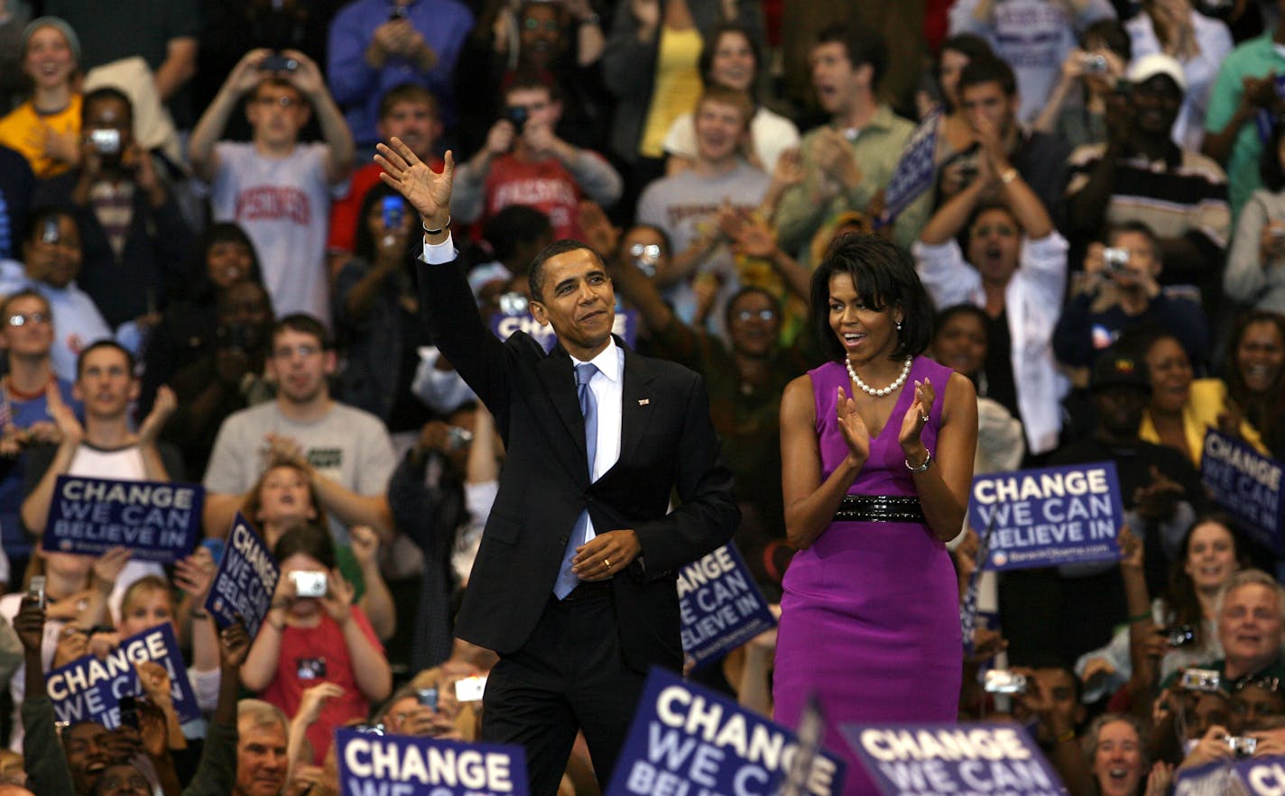 Barack and Michelle Obama were greeted by the crowd at the Xcel Energy Center on Tuesday night.