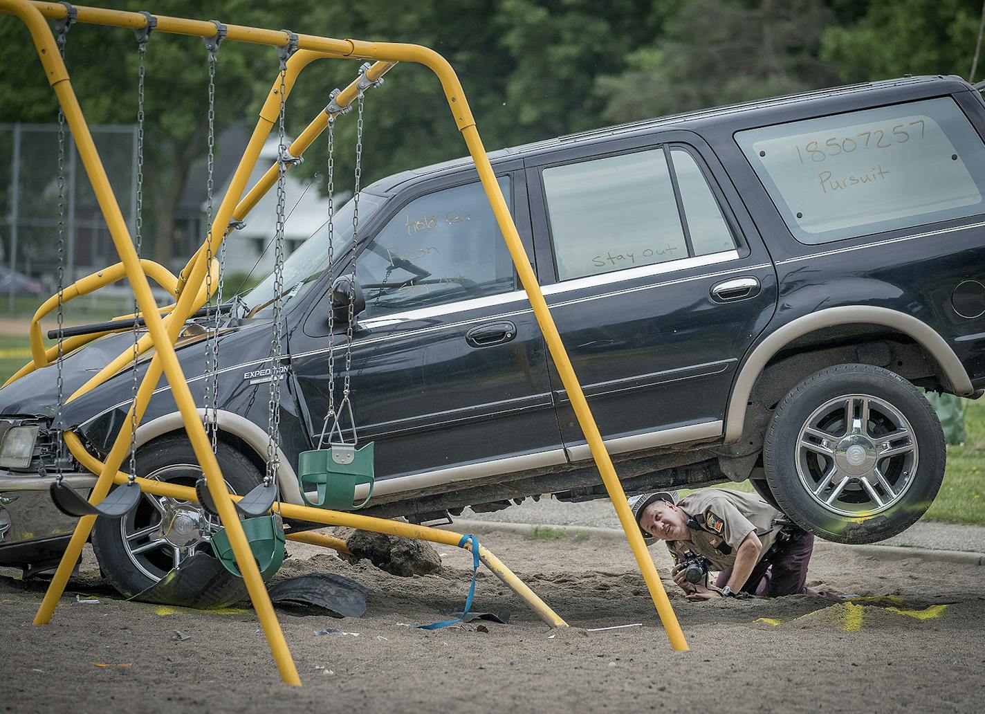 Minnesota State Patrol investigated the scene where a motorist being pursued by the State Patrol veered into a Minneapolis school playground and hit and severely injured three small children, Monday, June 11, 2018.