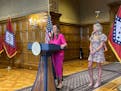 Arkansas Gov. Sarah Huckabee Sanders speaks at a news conference next to former Kentucky swimmer Riley Gaines at the state Capitol in Little Rock, Ark