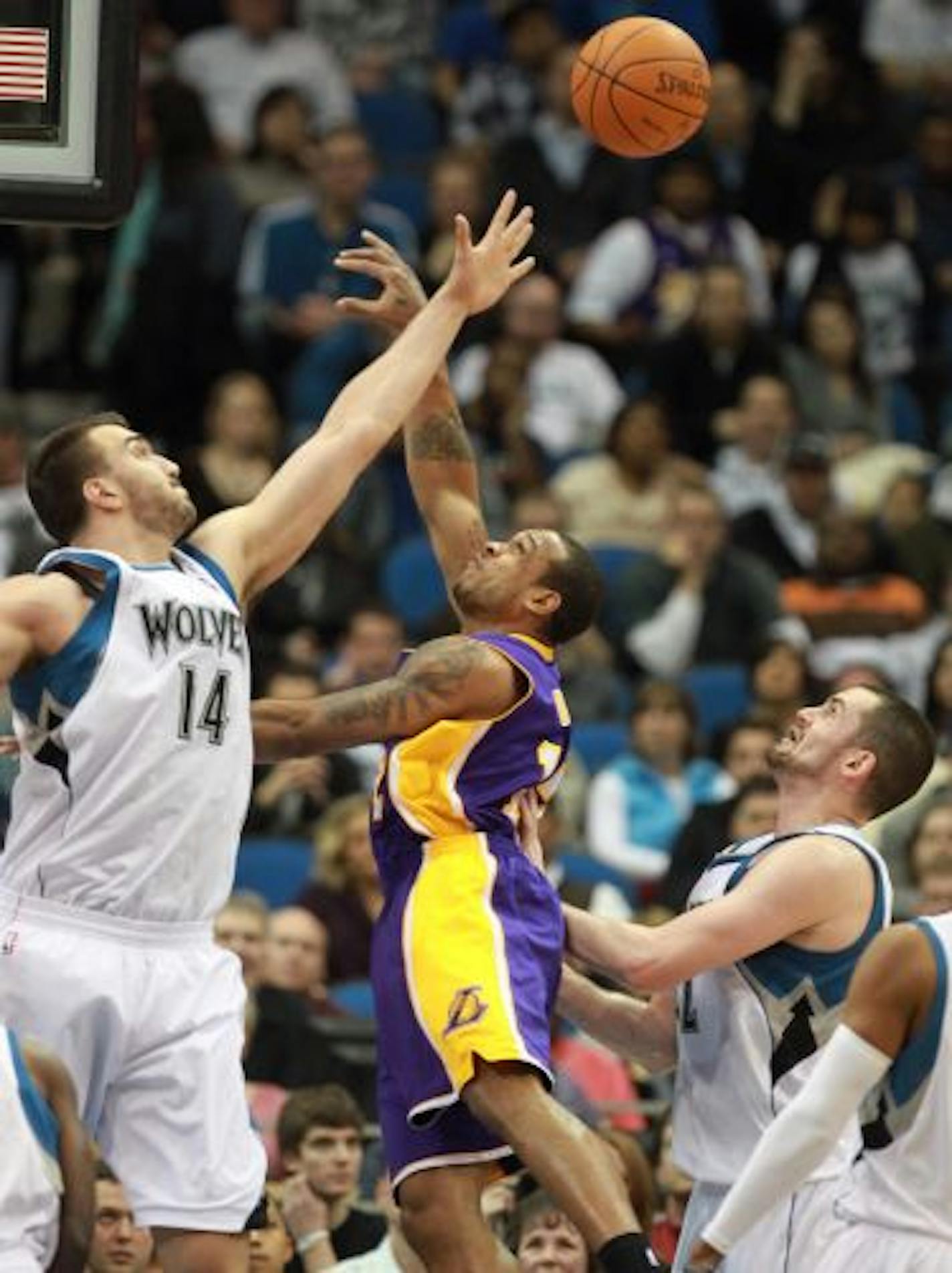 Wolves center Nikola Pekovic, left, blocked a shot by Shannon Brown in the second quarter Tuesday. It was a frustrating night for Minnesota big men as Pekovic and Darko Milicic combined for only four points and six rebounds.