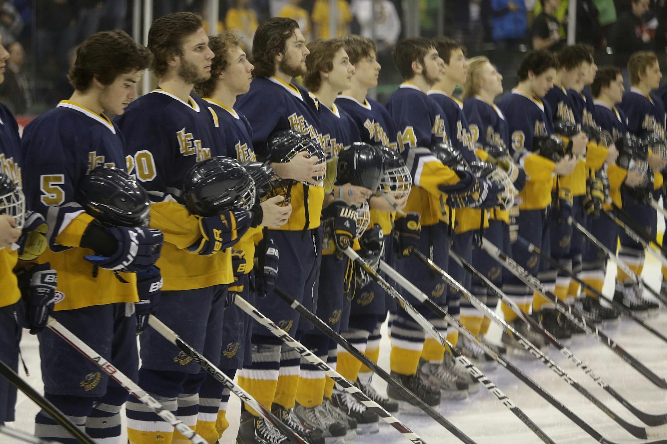 Hermantown lined up for the National Anthem at the Class 1A boys' hockey state tournament semifinals