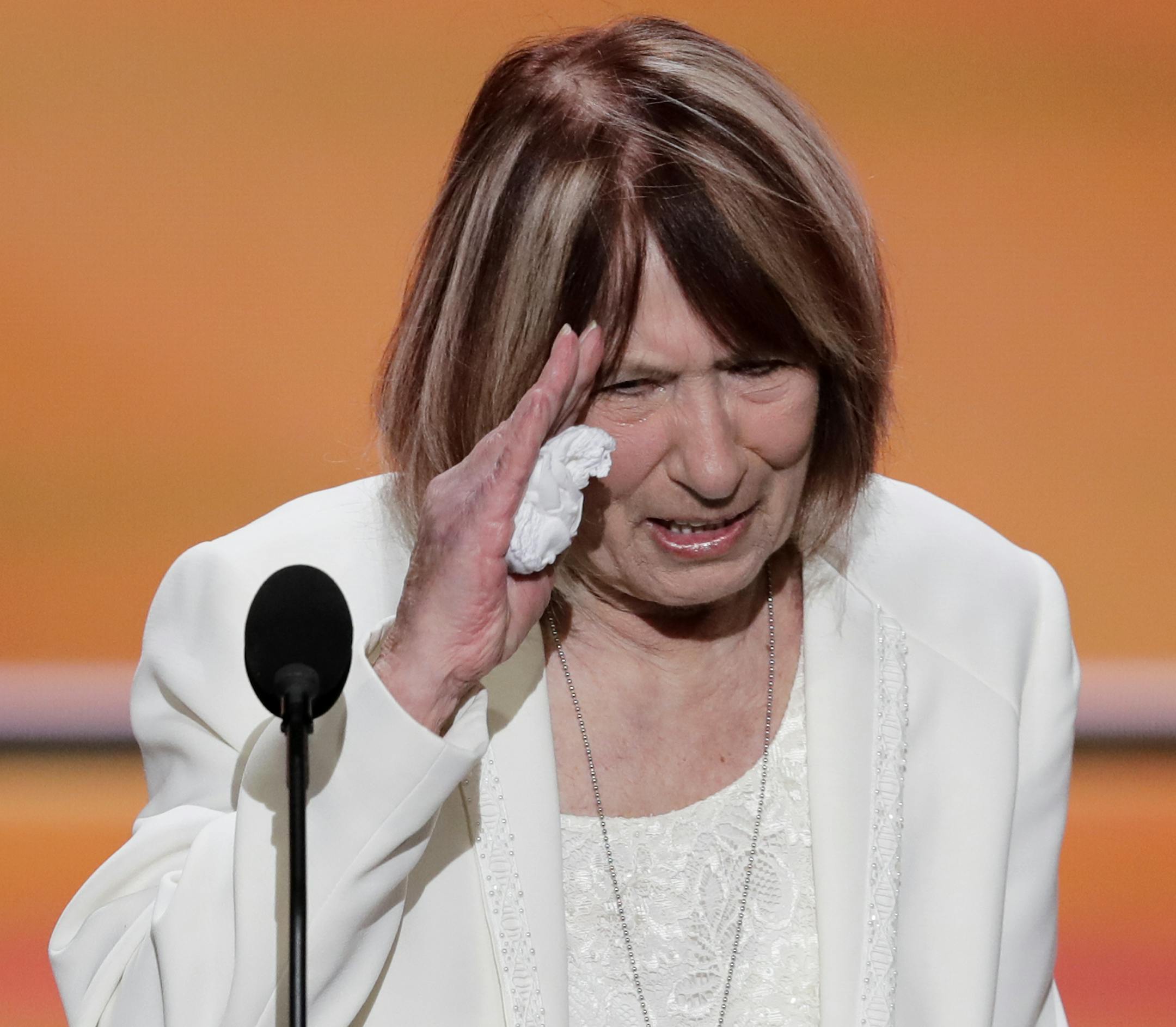 Pat Smith, mother of Benghazi victim Sean Smith, salutes after speaking during the opening day of the Republican National Convention in Cleveland, Monday, July 18, 2016. (AP Photo/J. Scott Applewhite)