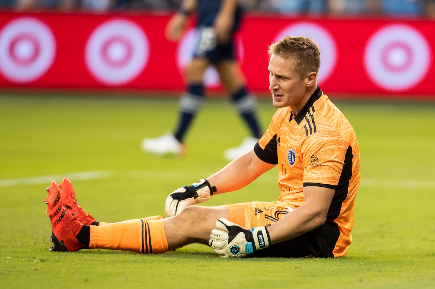 Sporting Kansas City goalkeeper Tim Melia reacts after conceding a goal during the first half of an MLS soccer match against the Seattle Sounders, Sunday, Sept. 26, 2021, in Kansas City, Kan. (AP Photo/Nick Tre. Smith)