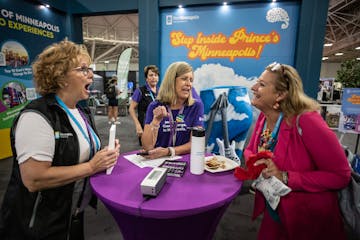 Meet Minneapolis officials Sue Murray, left, and Deb Taylor spoke Wednesday with Leslie Zeck of Alexandria, Va., at the Minneapolis Convention Center.