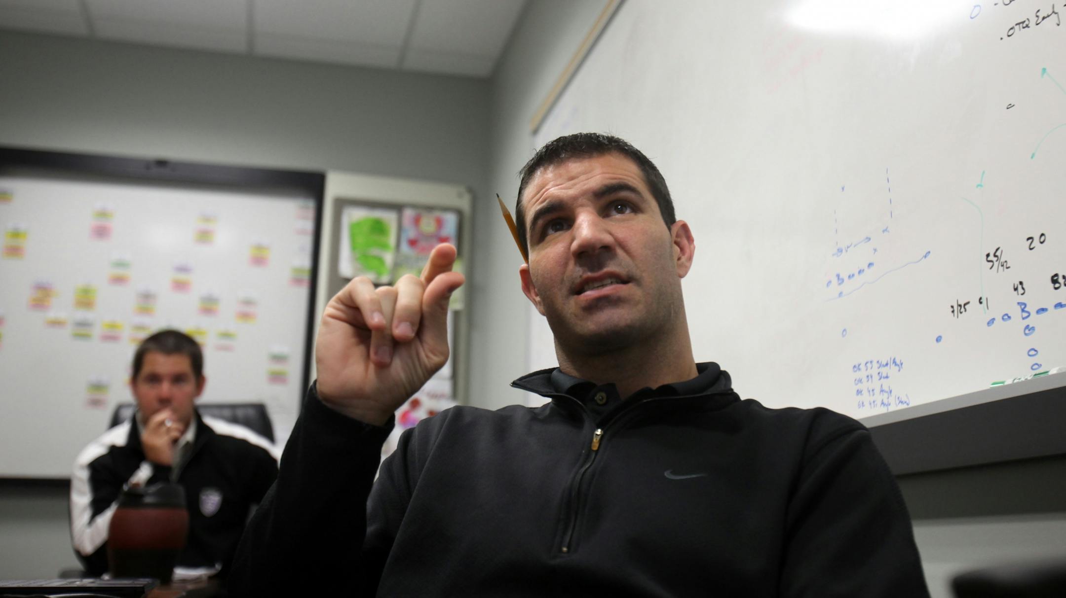 St. Thomas head coach Glenn Caruso pointed out things players needed to work on as he and his assistant coaches watched video from Tuesday's practice.