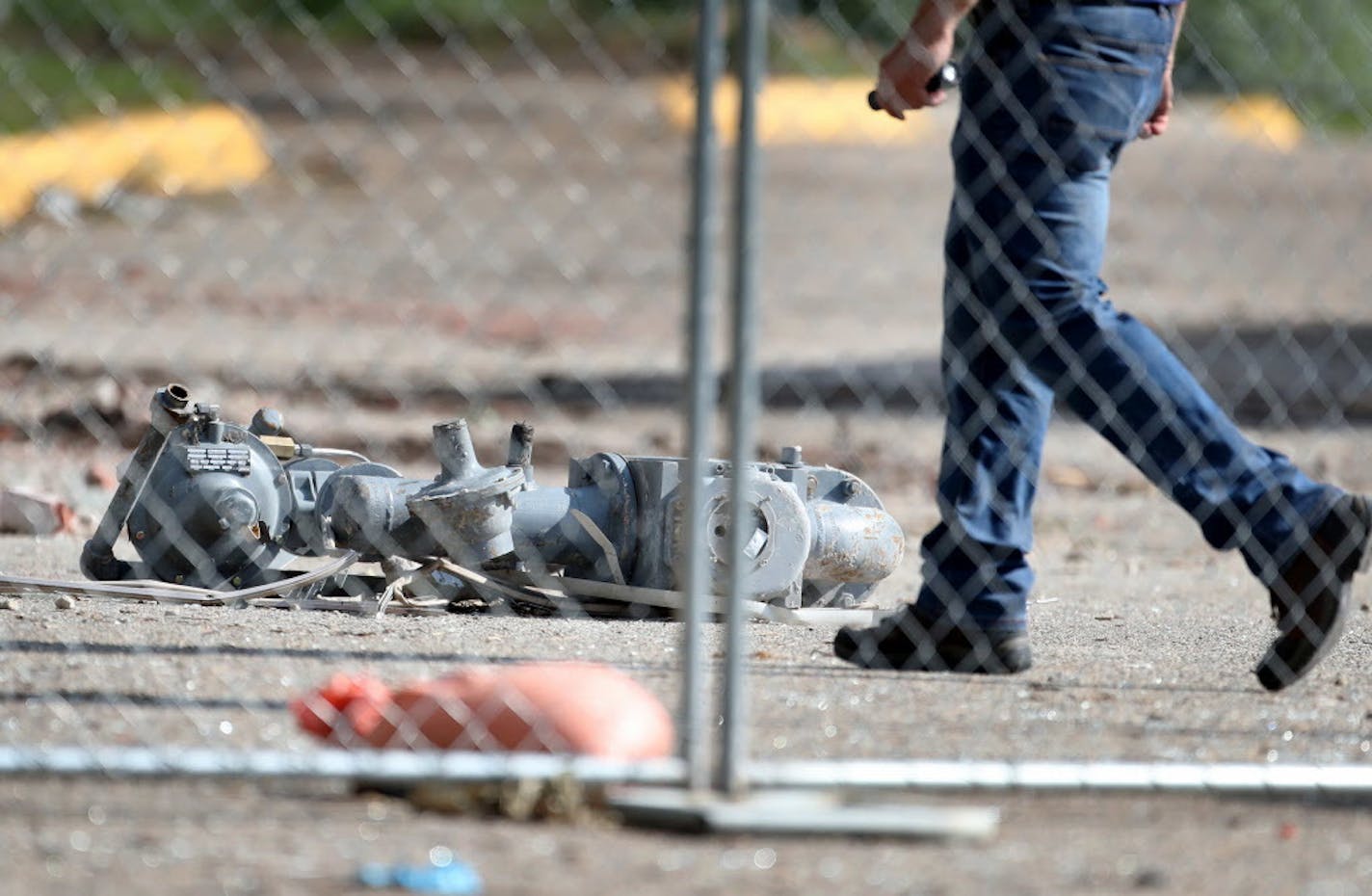 A natural gas meter rests on the ground and is visible two days after an explosion and building collapse at Minnehaha Academy that left two dead and several injured and seen Friday, Aug. 4, 2017, in Minneapolis.