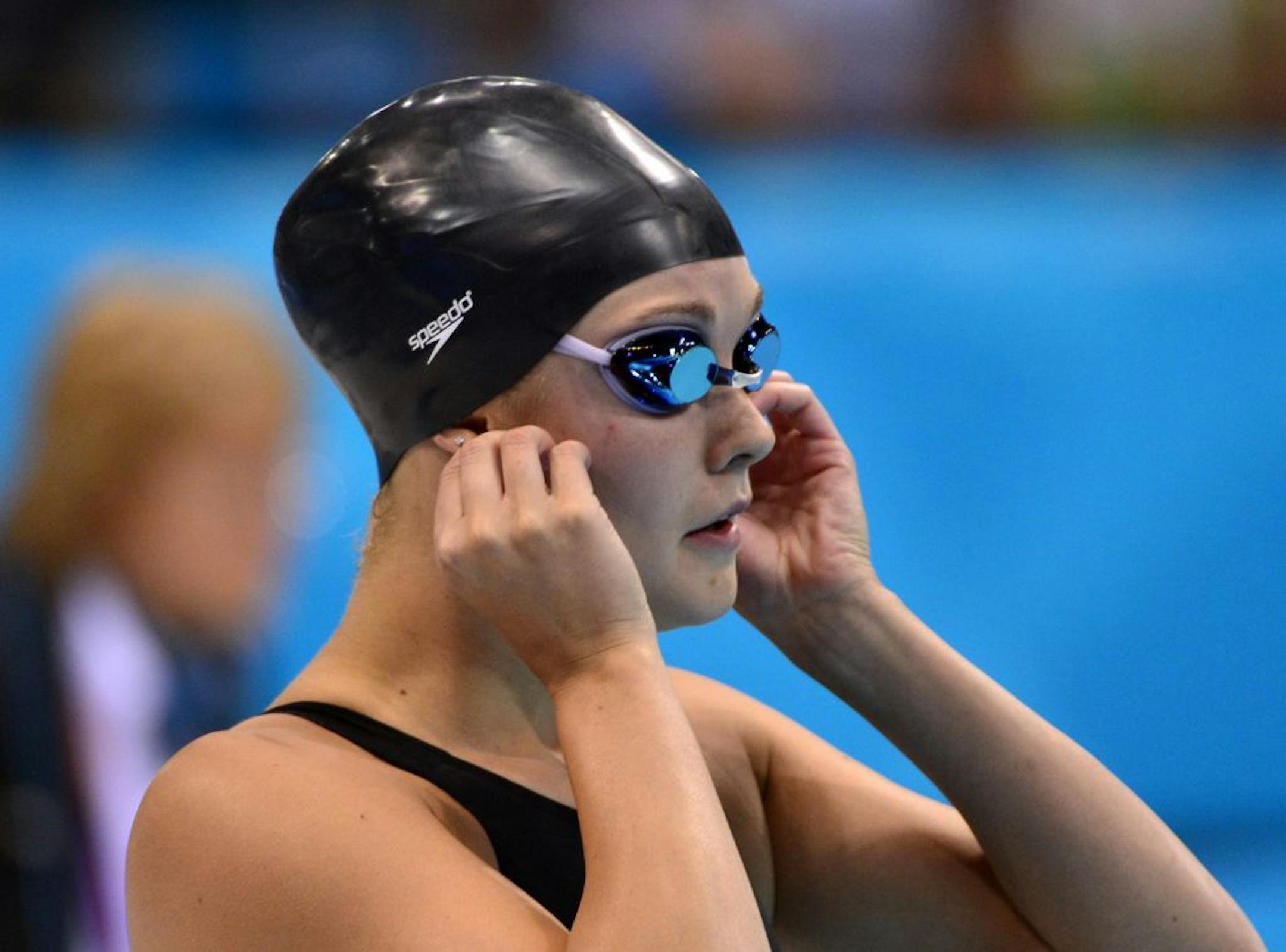 Rachel Bootsma's Olympic debut ended earlier than she hoped Sunday night, as the Eden Prairie swimmer finished 11th in the semifinals of the women's 100-meter backstroke and did not qualify for Monday's finals.Here, Bootsma checks her earings before the race like she has done every race before. They were her grandmothers.BRIAN PETERSON • brianp@startribune.comLondon, England - 07/29/2012