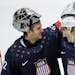 USA goaltender Jonathan Quick greets forward T.J. Oshie after Oshie scored the winning goal against Russia in a shootout during overtime of a men's ic