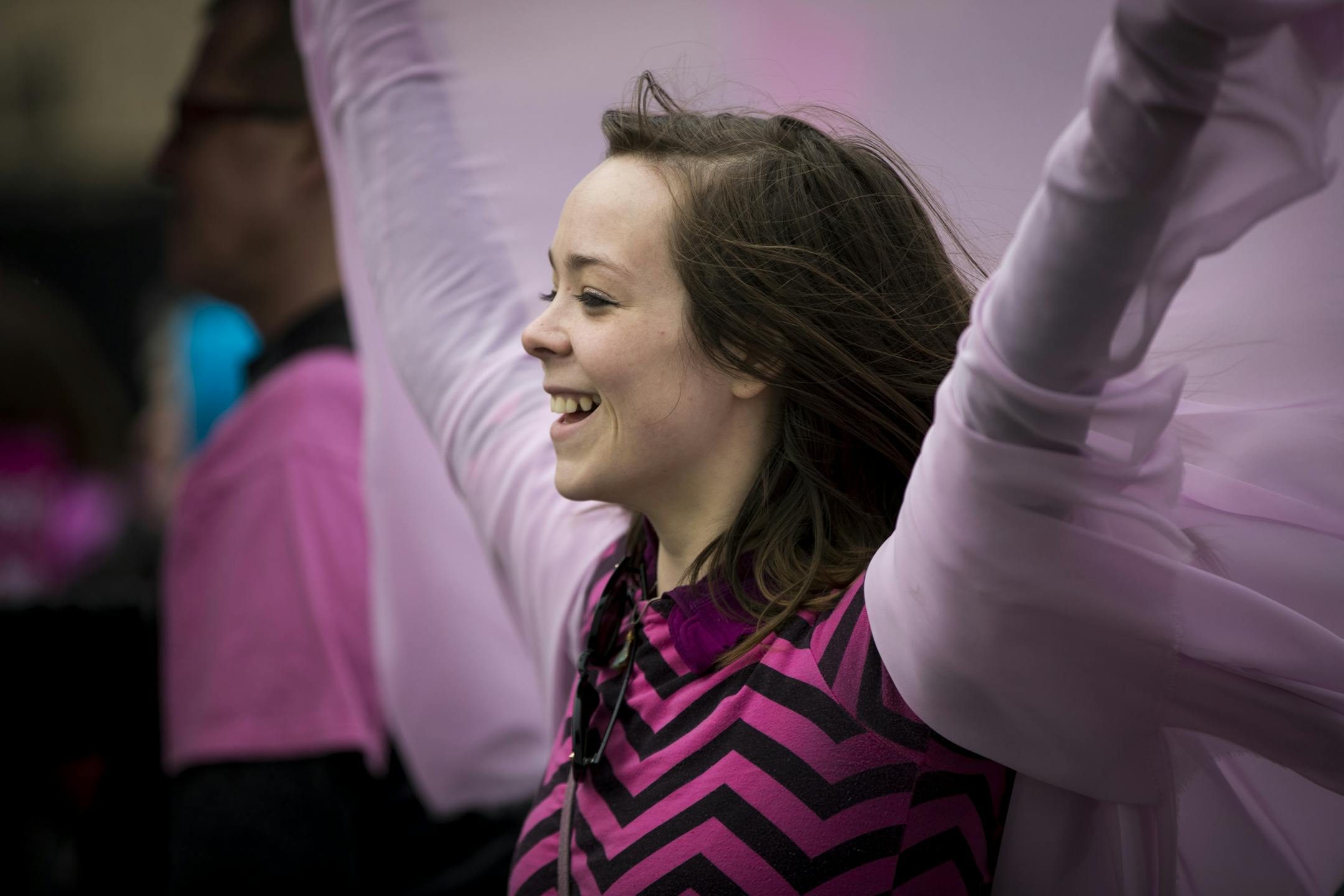 Saijen Weihe lifted her arms in joy with a flowing cape as she stood on the pro-choice side of the barrier between pro-choice and pro-life protesters outside Planned Parenthood in St. Paul, Minn., on April 14, 2017. ] RENEE JONES SCHNEIDER • renee.jones@startribune.com