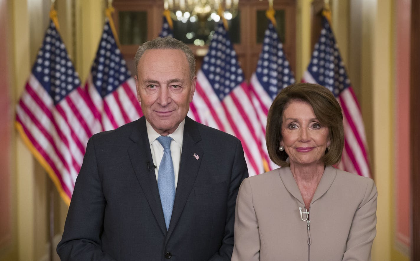 Senate Minority Leader Chuck Schumer of N.Y., and House Speaker Nancy Pelosi of Calif., pose for photographers after speaking on Capitol Hill in response President Donald Trump's address, Tuesday, Jan. 8, 2019, in Washington. (AP Photo/Alex Brandon)