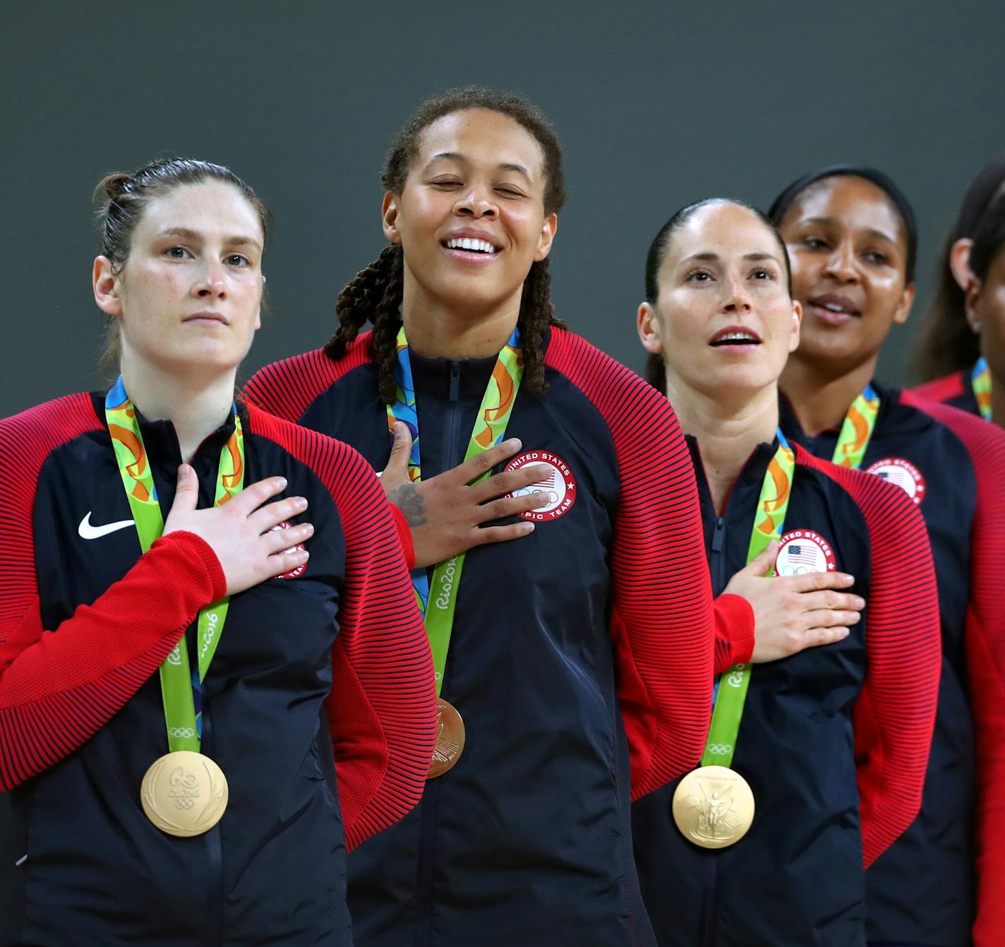 The USA women&#xed;s Olympic basketball team savors the moment during the national anthem after their 6th consecutive gold medal win. Here, Lynx players Lindsay Whalen and Seimone Augustus (left) Sue Bird, Maya Moore also with the Lynx, and Angel McCoughtry. The Lynx's Lindsay Whalen scored 17 points off the bench in the victory, giving the U.S. women's basketball team its sixth consecutive gold medal. ] 2016 Summer Olympic Games - Rio Brazil brian.peterson@startribune.com Rio de Janeiro, Brazil