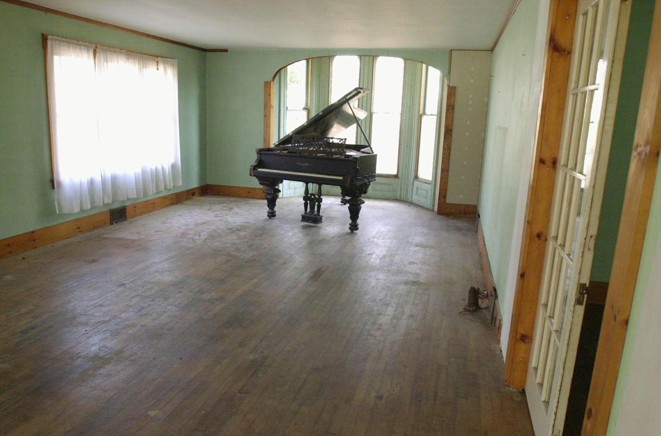 **ADVANCE FOR SUNDAY MAY 18**An old grand piano sits in the front room of the future site of a proposed pediatric clinic and dentist's office that would be built in a vacant 150-year-old home on the grounds of the Westshire Elementary School in West Fairlee, Vt., Wednesday, April 16, 2003. The Rivendell school district _ which includes the towns of Vershire, Fairlee and West Fairlee in Vermont and Orford, N.H. _ is starved for primary care health services, said Dr. James Hughes. The 40-mile-long