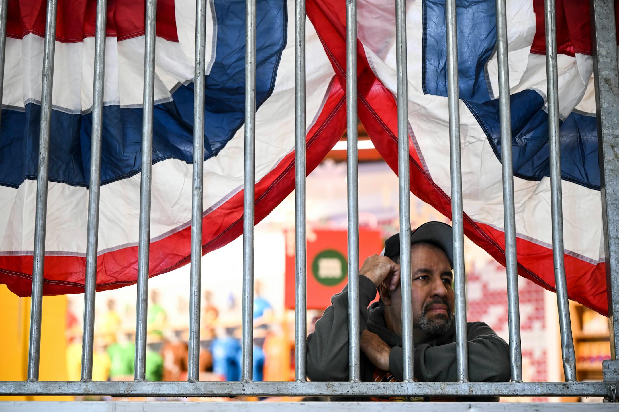 Jose Barajas, of Mound, watches as Twins players talk to media following their new logo and jersey unveiling.